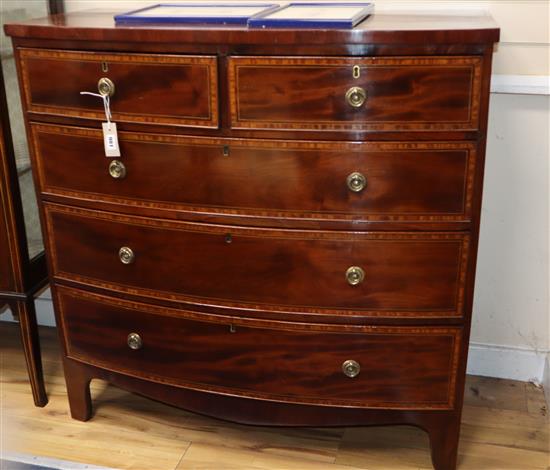 A late Regency mahogany crossbanded and inlaid bowfront chest of drawers W.102cm